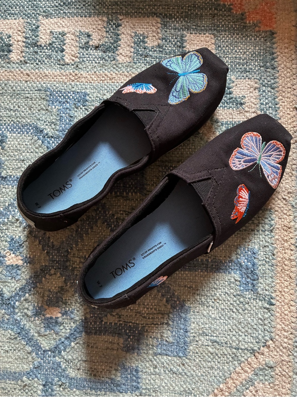 TOMS Black Canvas Slip-On Flats with Blue & Pink Butterfly Embroidery